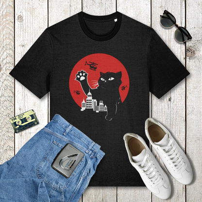 Black t-shirt with a cat graphic on a wooden surface with jeans, sneakers, and sunglasses.