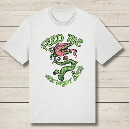 White t-shirt with a graphic design of a venus fly trap and text on a wooden surface
