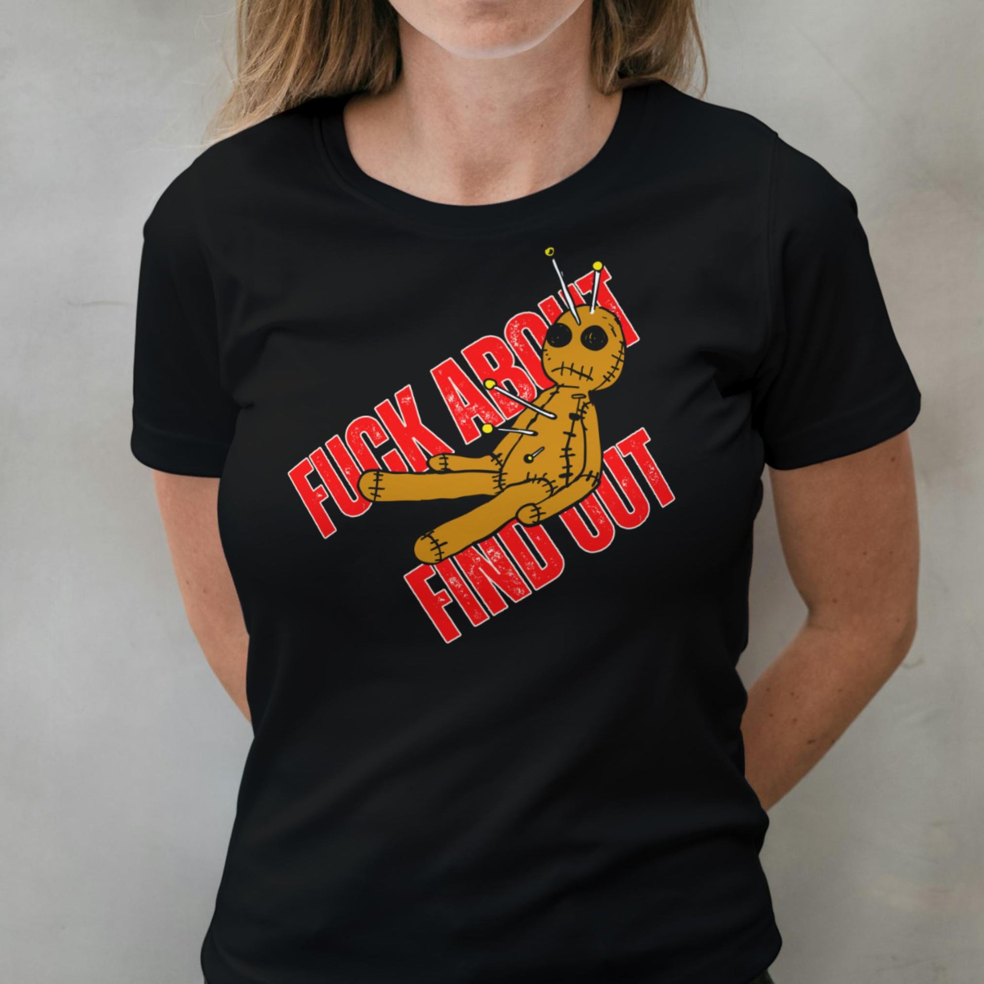 Person wearing a black t-shirt with a graphic design and text.
