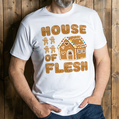 Person wearing a white t-shirt with a gingerbread-themed design against a wooden background