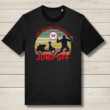 Black t-shirt with graphic design and text on a wooden surface