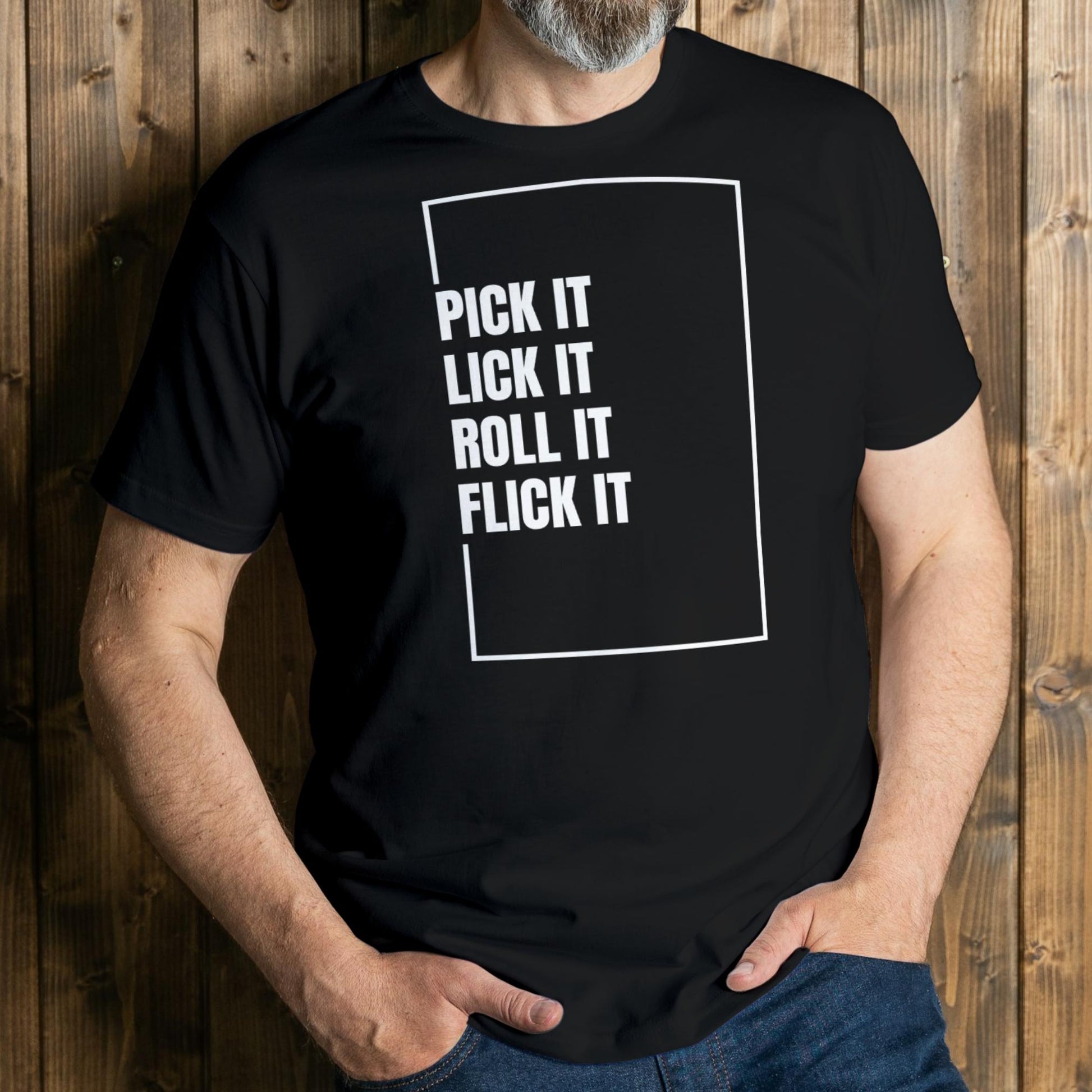 Person wearing a black t-shirt with white text against a wooden background