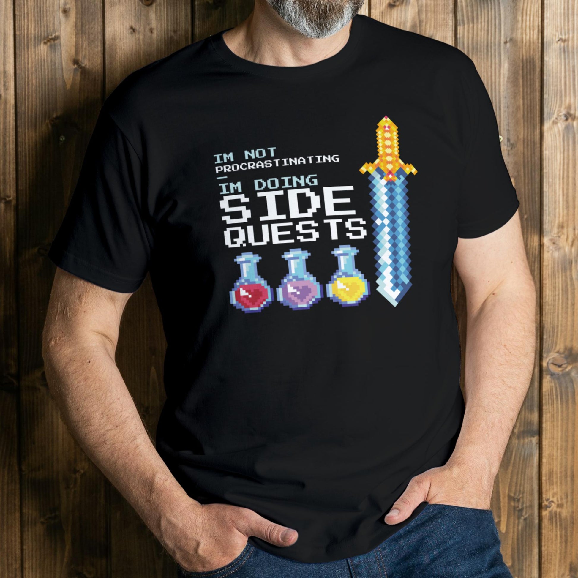 man wearing side quest graphic tee