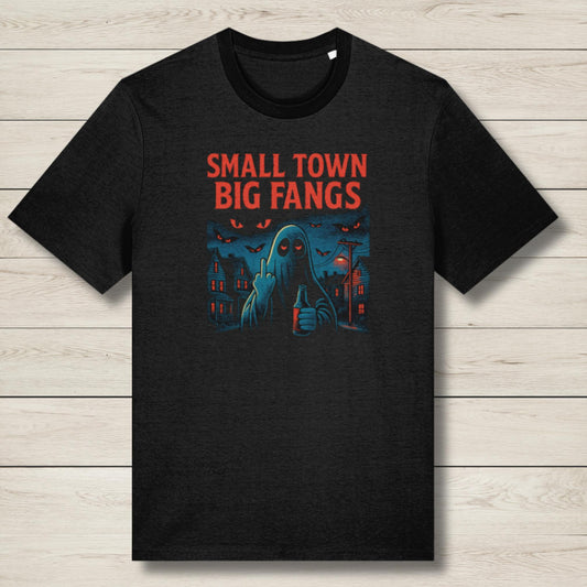 Black t-shirt with 'Small Town Big Fangs' graphic design on a wooden surface
