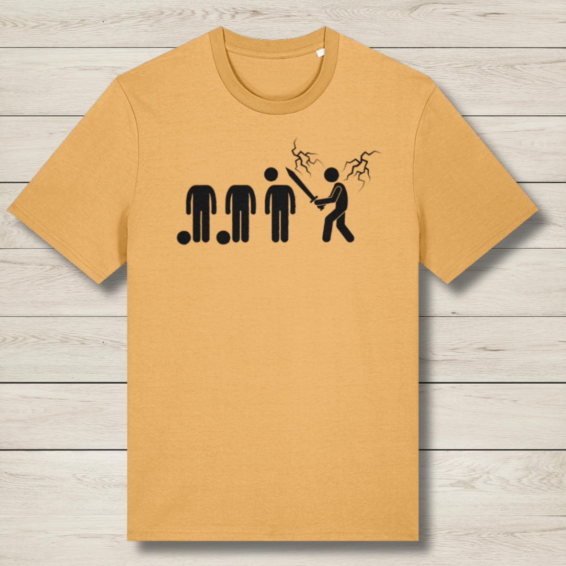 Mustard yellow t-shirt with black graphic design on a wooden surface