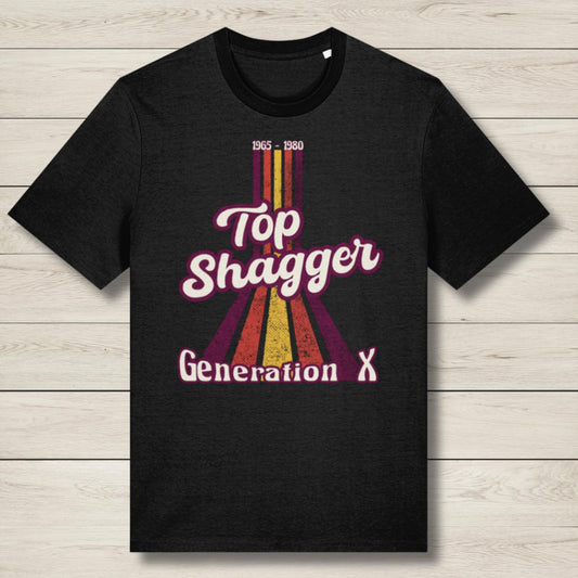 Black t-shirt with 'Top Shagger Generation X' design on a wooden surface