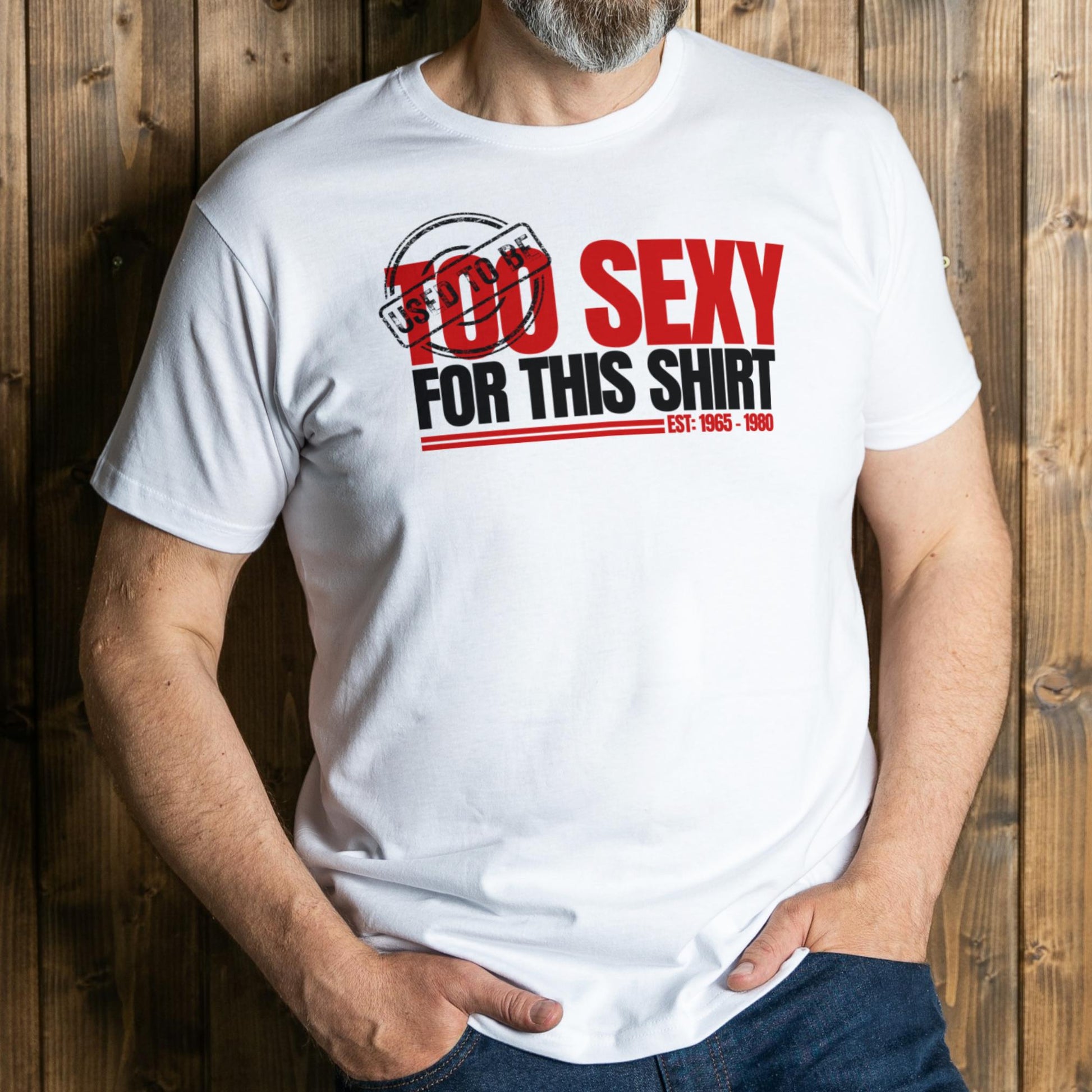Person wearing a white t-shirt with red and black text against a wooden background